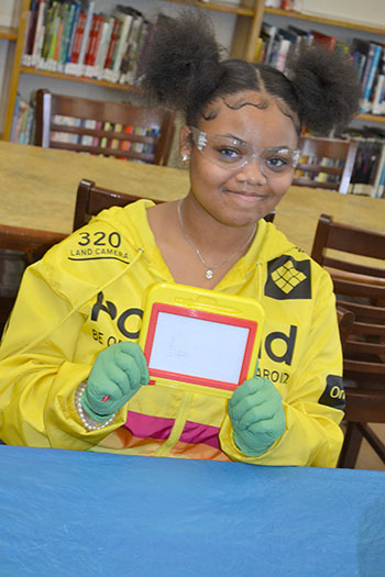 A Franklin STEAM Studio student with her erasable writing sketch pad.