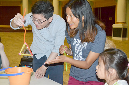 MechSE Assistant Professor Jie Feng and Adriana Carola Salazar Coariti demonstrate the bubble activity for youngsters at the Orpheum.