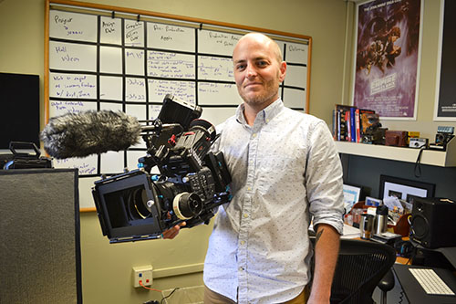 John Isberg with his favorite piece of equipment, the camera he used while filming Magnetic Fields.