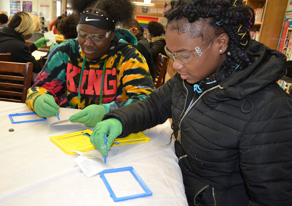 Franklin students finish dismantling their Magnadoodles.