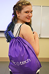 ChicTech participant proudly displays her Swag Bag.