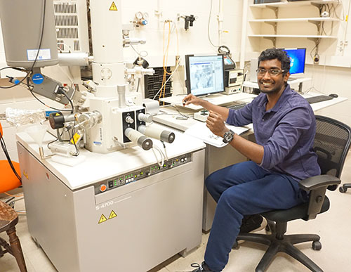 I-MRSEC undergrad Davis Zackaria using the SEM in the MRL. (Image courtesy of Pamela Pena Martin.)