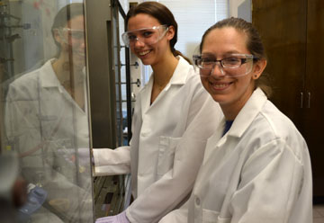 Emily Rabe and post-doc researcher Dawn Ernenwein work on HPG research.