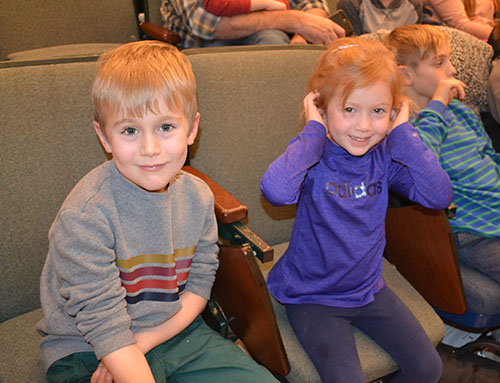 Two local youngsters enjoying Chemistry's 2019 edition of the Holiday Magic show.