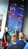 Local kids play Orphy's Escape to Space in the Orpheum's new Astronomy Kids' Corner