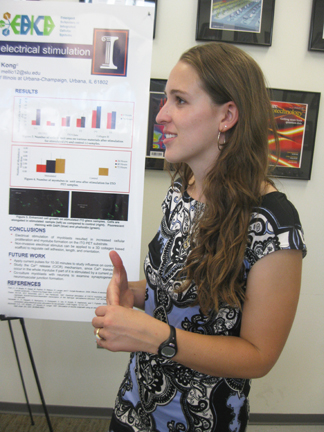 Morgan Elliot explains her research during the EBICS final poster presentation.