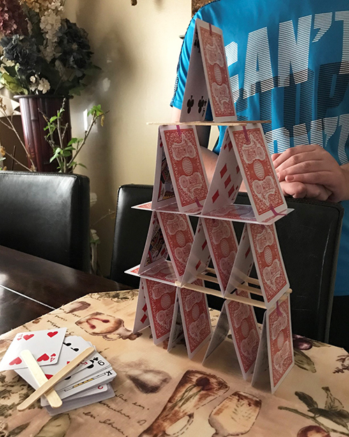 Engineering Exploration participant exhibits the tower they built as part of the engineering challenge related to Civil Engineering.