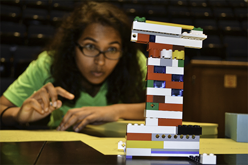 During the 2015 WIE Orientation, an Engineering freshman competes in a Lego team-building activity.