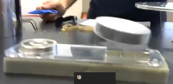 During Nadya Mason's presentation about the effect of temperature on materials, she demonstrates how a superconductor material which she had immersed in liquid nitrogen can 