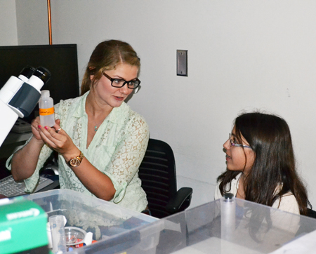 Grad student interacts with a Pollen Power camper during one of the sessions.