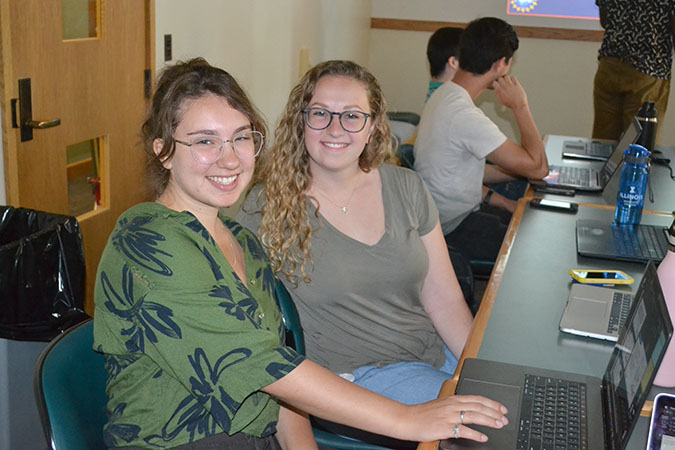 Biomedical Imaging REU participants Cheri McChesney and Mary Kramer wait their turn during a practice session where the undergrads gave their oral presentations to each other. 