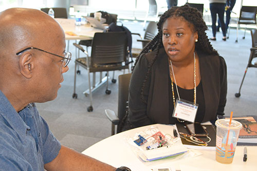  Donnell White, a science teacher, and Stephanie Miller, a counselor, both at John M. Smyth IB World School in Chicago, chat about their STEM club during a planning session.