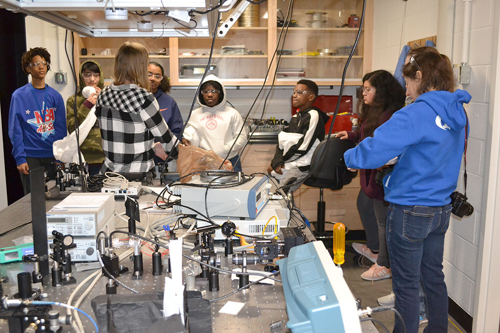 Franklin students learn about different kinds of light during a visit to Profesor Gina Lorenz's lab on quantum optics, atomic/molecular spectroscopy, and optical magnetometry.