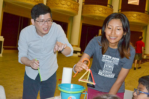 Jie Feng and Adriana Carola Salazar Coariti demonstrate the bubble activity for youngsters at the Orpheum.