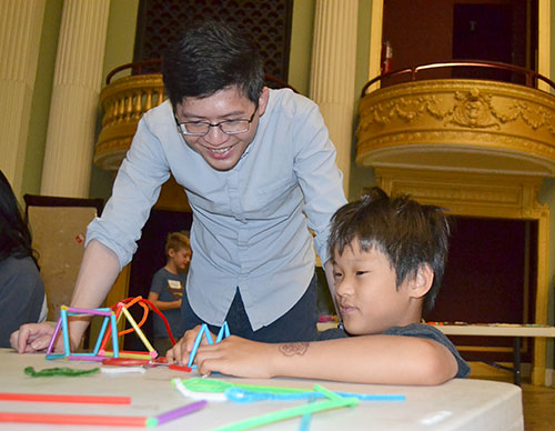  Jie Feng admires the structure of the bubble wands a young boy at the Orpheum designed.