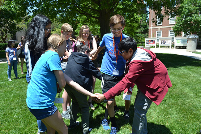 SIM camp students participate in the human knot activity.