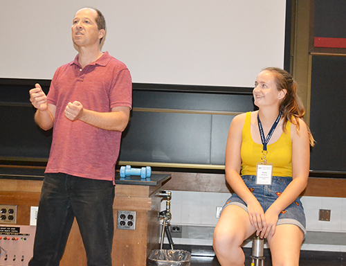 On the first night of WIE Orientation, Physics Professor Tim Seltzer does a physics demo using a brave volunteer from the audience.