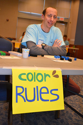 Fifth year Math PhD student Joseph Rennie mans the Color Rules game.