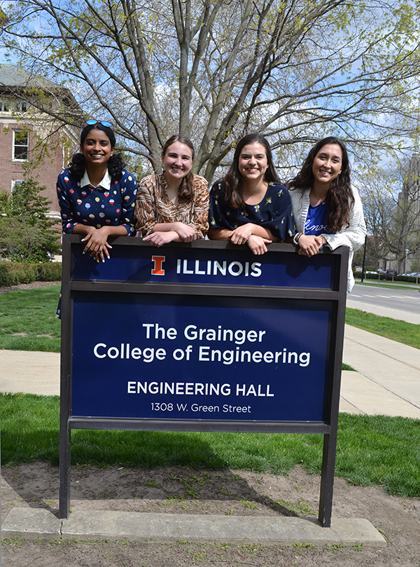 Engineering seniors Shivani Ganesh, Courtney Leverenz, Eugenia Maldonado, and Berat  Gulecyuz by the Engineering Hall sign.