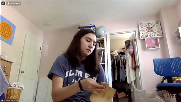 An aerospace GAMES camper works on building her rocket.