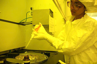 A trainee conducting a lithography experiment in a cleanroom at the Micro and Nanotechnology Laboratory
