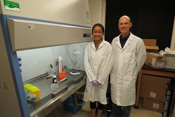 Bioengineering junior Joy Chen, with her mentor, cancer researcher Dr. Erik Nelson.