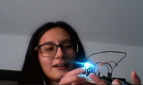 Kelly Acosta shows the Arduino and LED light she did.
