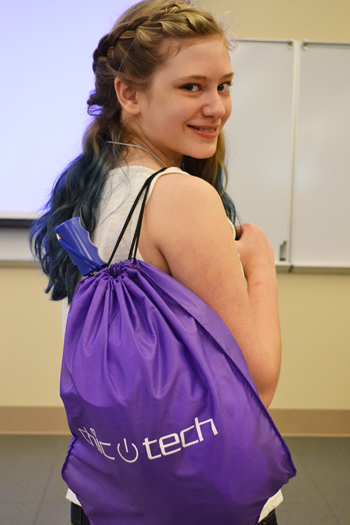 ChicTech participant shows off her Swag Bag.