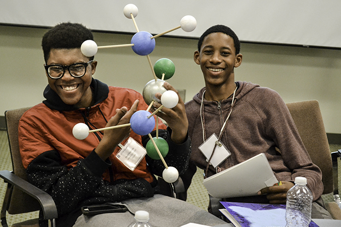 UHS students show off their molecule.