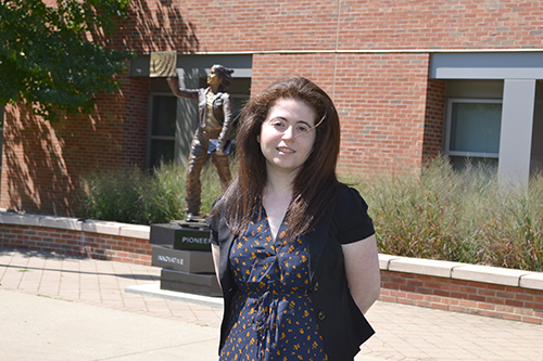 Keynote Speaker, Amy Doroff, in front of the Quintessential Engineer statue.