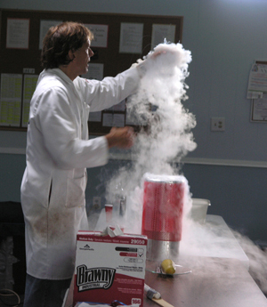 Don Decoste explains the properties of liquid nitrogen to the campers.