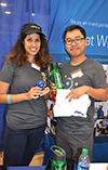 Two Schlumberger recruiters show off some of the swag they gave away at the fall 2018 ECF.