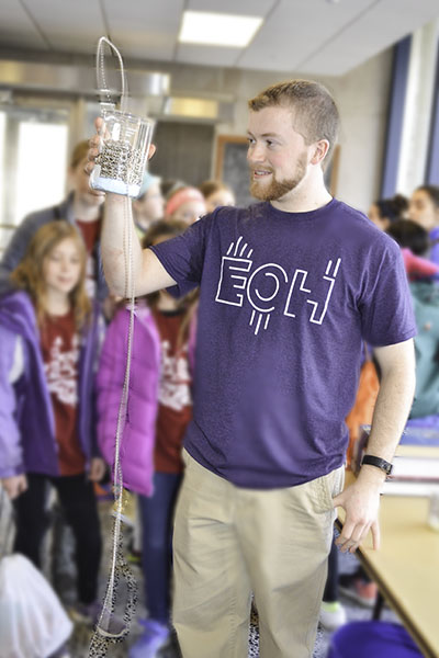 Austin Steinforth, Electrical Engineering Ph.D. student, who says he has been presenting his self-siphoning beads demo at EOH for the last several years