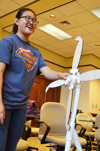A GBAM G.A.M.E.S. camper adjusts her team's windmill during the competition the final day of camp.