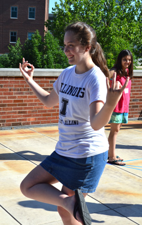 Briana Chapman strikes a unique pose as part of a human graphs activity during GEMS camp.