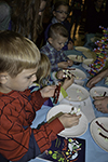 A group of youngsters make DNA structures out of candy at the Delicious DNA activity booth.