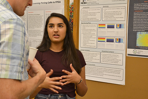 An INCLUSION REU participant, Lisa Kanbur, presents her research at the end-of-the summer Poster Session at NCSA.
