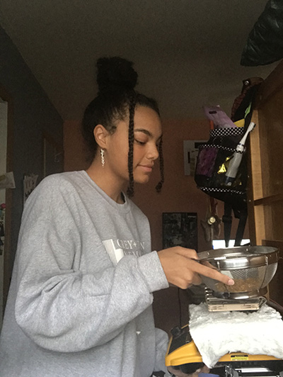 Jasmine O'Connor dries food as part of her POETS Young Scholars summer research project. (Image courtesy of Jasmine O'Connor.) 