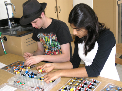 Two Uni High students work with Lego kit on DNA/RNA in order to determine its usefulness as a hands-on learning tool.