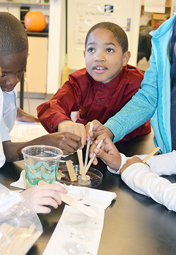 A BTW 3rd grader participates in one of NanoSTRuCT's hands-on activities about biotechnology.