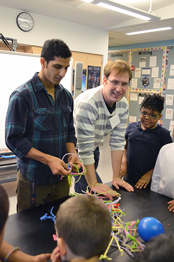 Alex Cerjanic, NanoSTRuCT co-founder and leader, interacts with students during one of their sessions.