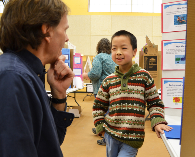  Chemistry professor Don Decoste discusses science with a Next Generation student.