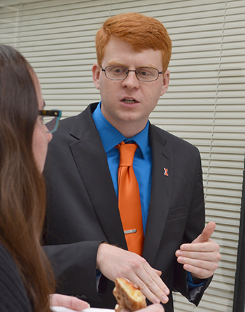 Vet Med student Bennett Lamczyk (right) discusses his research with a visitor during the poster session.