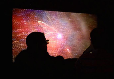 Visitors to NCSA's Advanced Visualization Lab watch visualizations of scientific phenomena on earth and in space