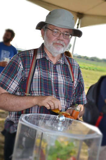 Illinois Professor, who has a nearby research plot, enjoys a plate of food, most of which was grown and prepared by Dining Services.