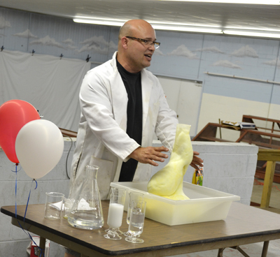 Jesse Miller performs a demonstration with hydrdogen peroxide and soap.