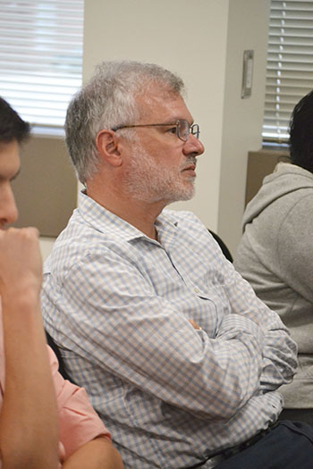 David Cahill listens to Doumont's presentation during the November 2019 workshop.