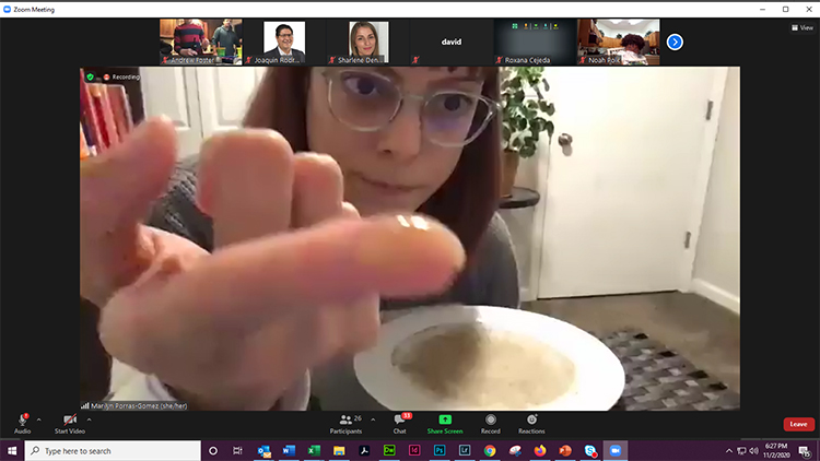 During her November 2nd presentation, Marilyn Porras-Gómez, a third-year Materials Science and Engineering Ph.D. student, shows how pepper sprinkled on water on a plate floats on the top due to surface tension.