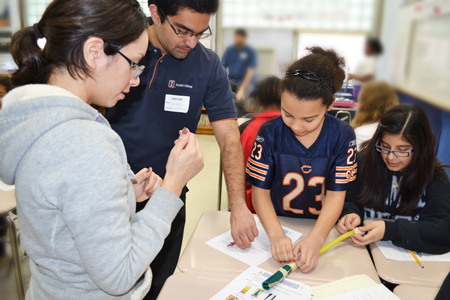 iRISE grad students work with Edison middle schoolers on their design project.