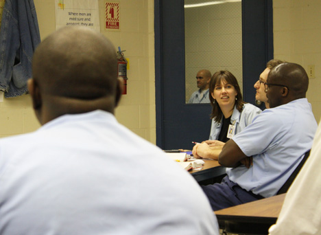 Sarah Lubienski (center) interacts with an EJP scholar while teaching a workshop at Danville Correctional Center.